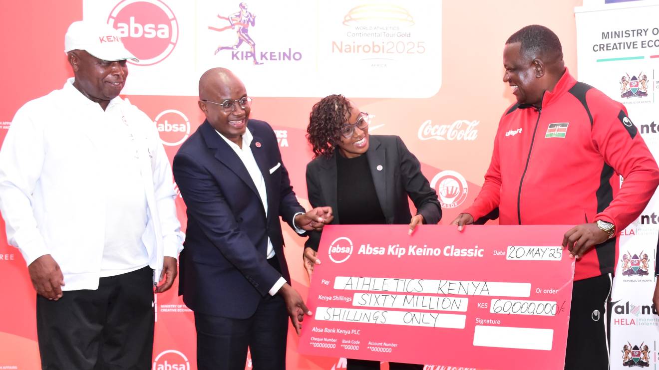 Salim Mvurya receives a Sh60 million sponsorship cheque from Absa Kenya’s  Moses Muthui and Mwihaki Wachira. Looking on is Athletics Kenya President General Jackson Tuwei. PHOTO/COURTESYQ
